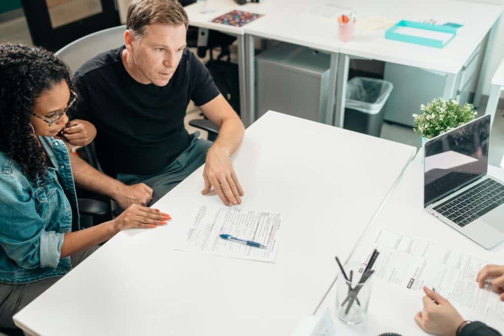 A couple is consulting a local estate agent